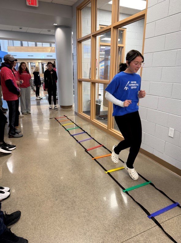 A student performing an agility drill.