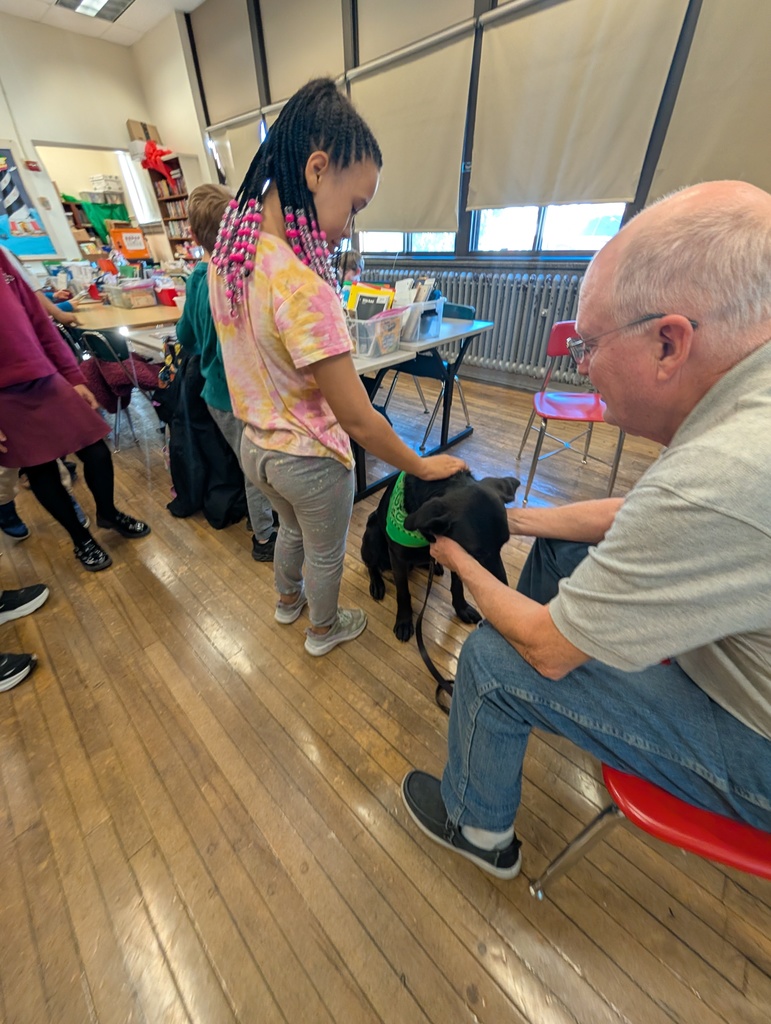 Pepper being petted by a female student.