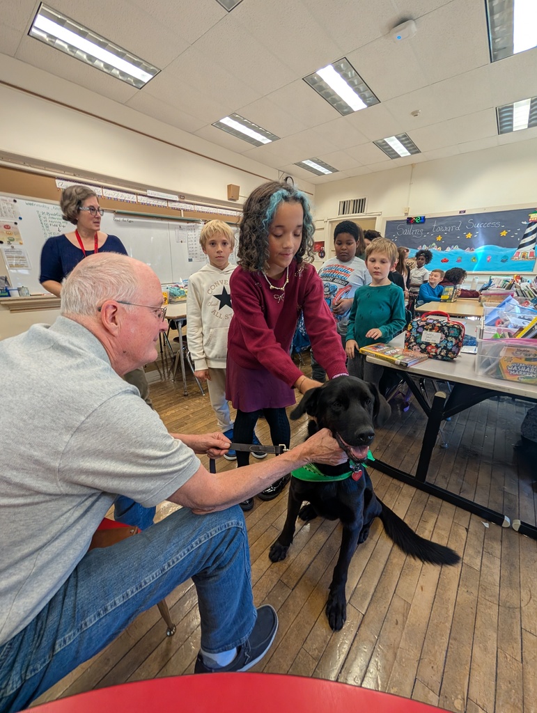 A line of students wait to pet Pepper.