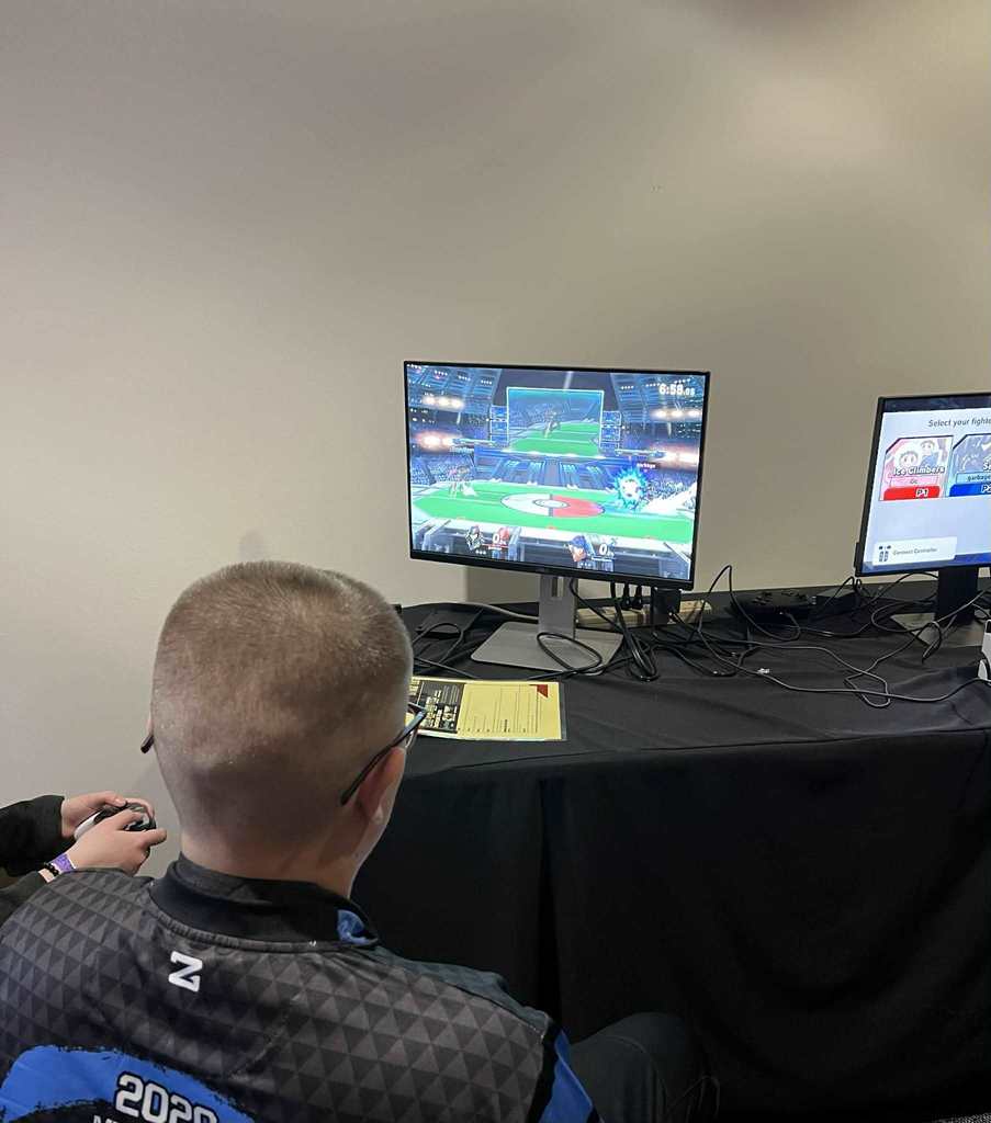 A REAL School player, playing Smash Bros. during the state tournament.