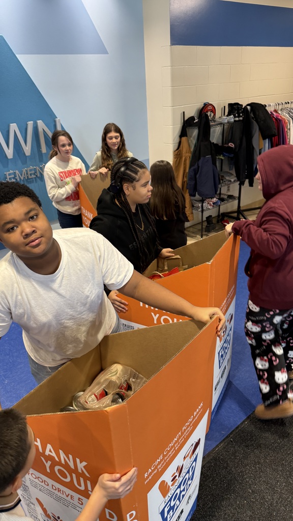 Olympia Brown School's student ambassadors moving the food boxes.