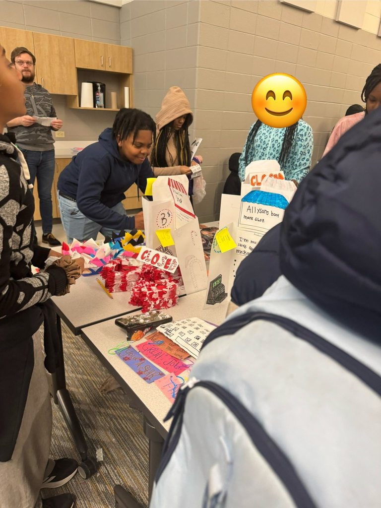 Students purchasing items from their classmates' storefronts. 