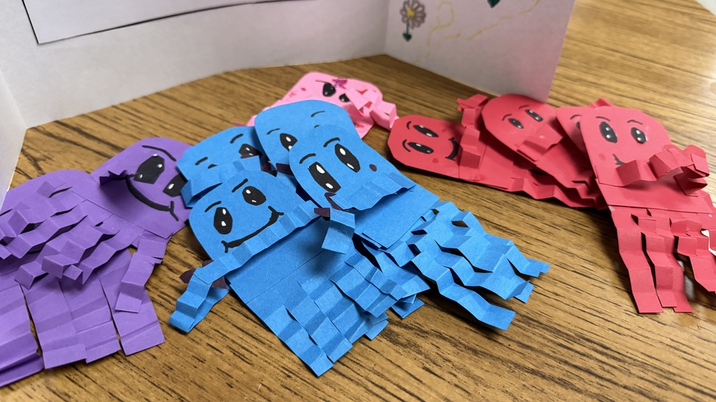 Purple, blue, pink and red handmade paper jellyfish.