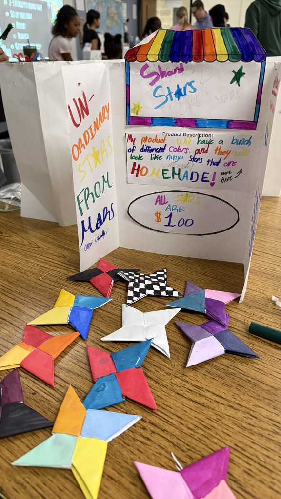 An assortment of colorful, handmande paper shooting stars.