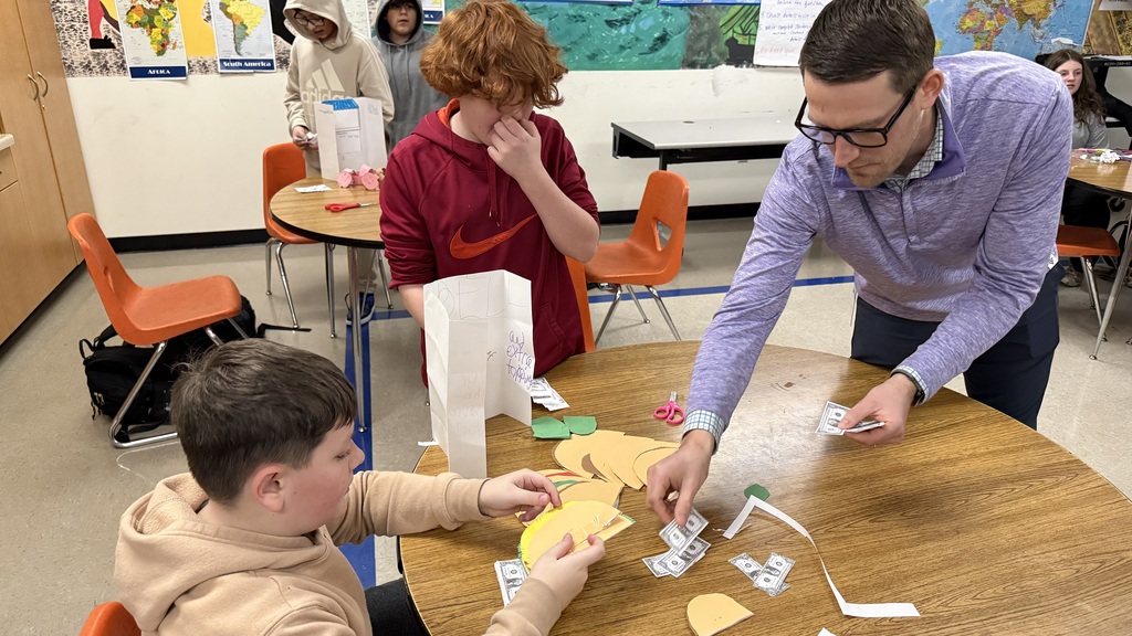 Principal Jacobsmeier buys not one, but TWO paper tacos.
