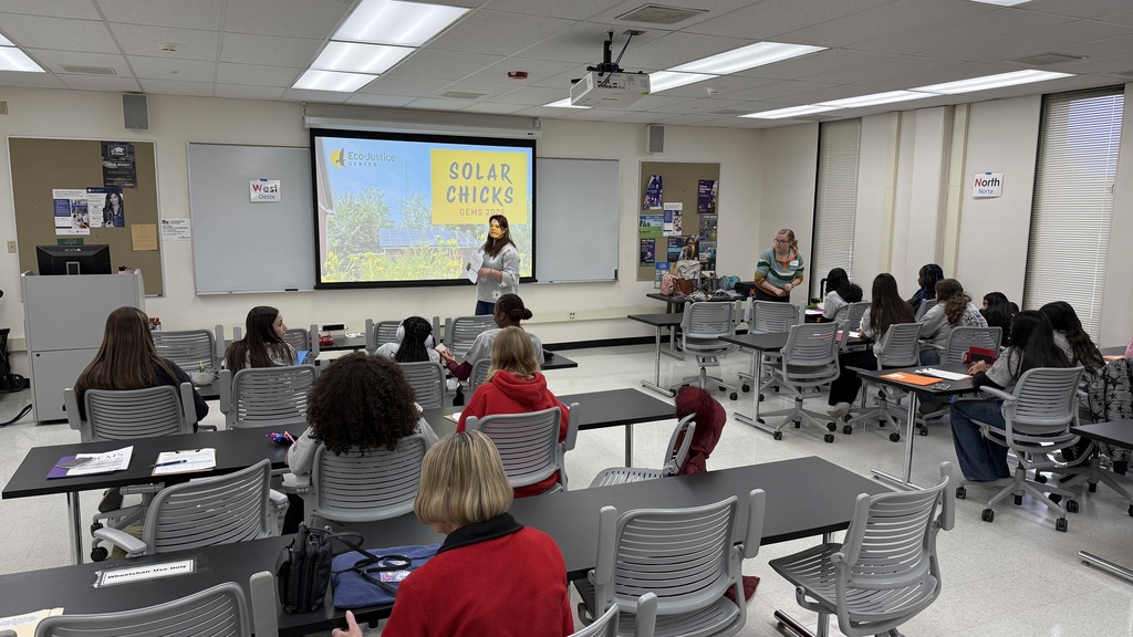 Students in a classroom learning about solar power.