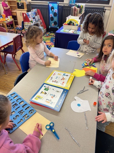 Students building writing and letter recognition skills.