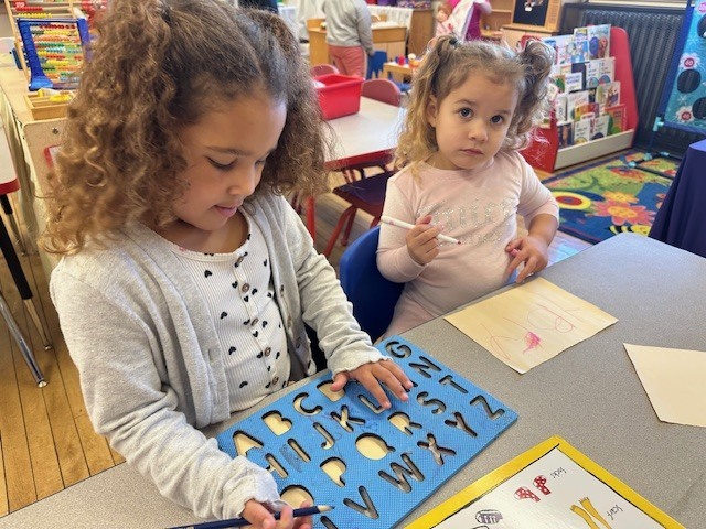 Students building writing and letter recognition skills.