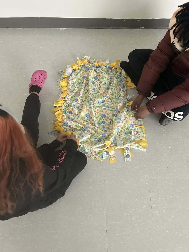 Students making blankets.