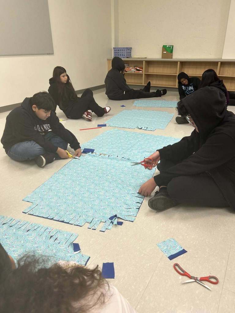 Students making blankets.