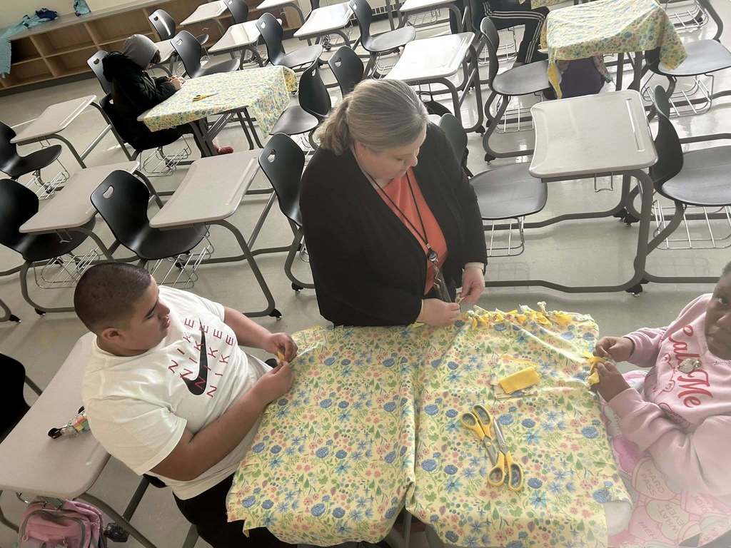 Students making blankets.