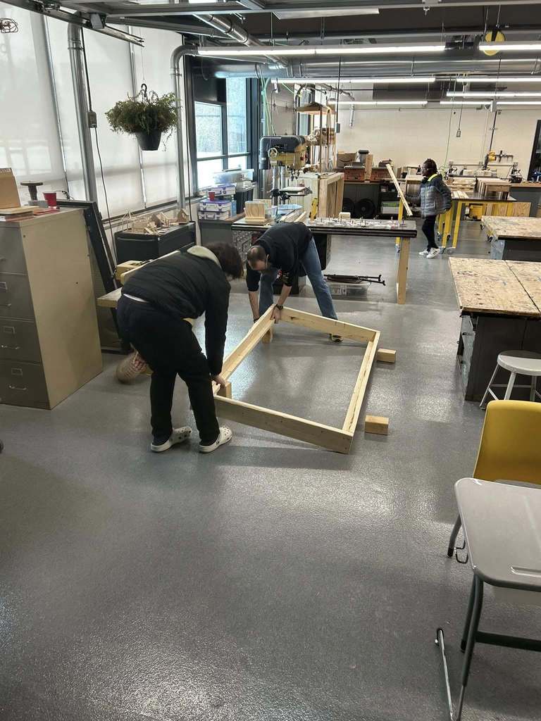 Students making bed frames.