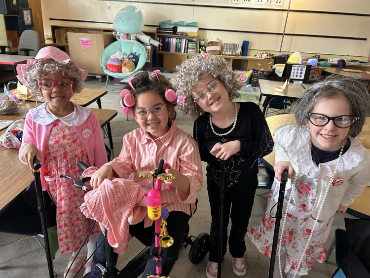 picture of kinder students dressed as 100 year olds.
