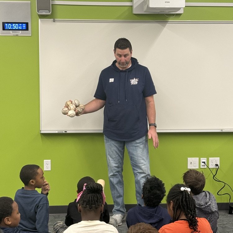 Marcus Hanel holding seven baseballs in his hand.