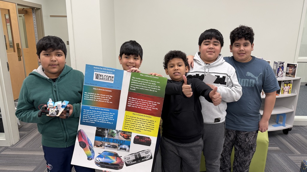 Five Julian Thomas students pose for a group photo after their presentation