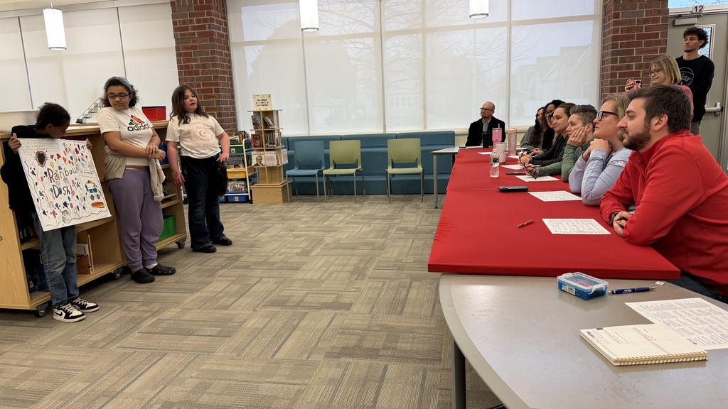 Three Knapp students present their project to the guest judges