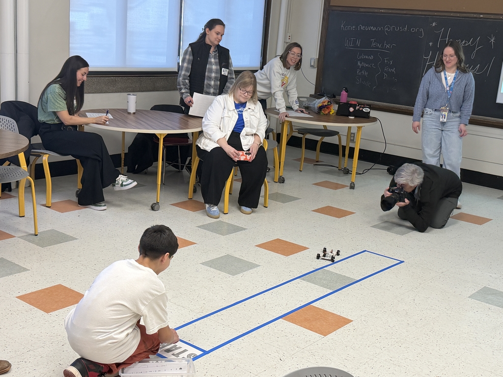 A Mitchell student races their car on the track.