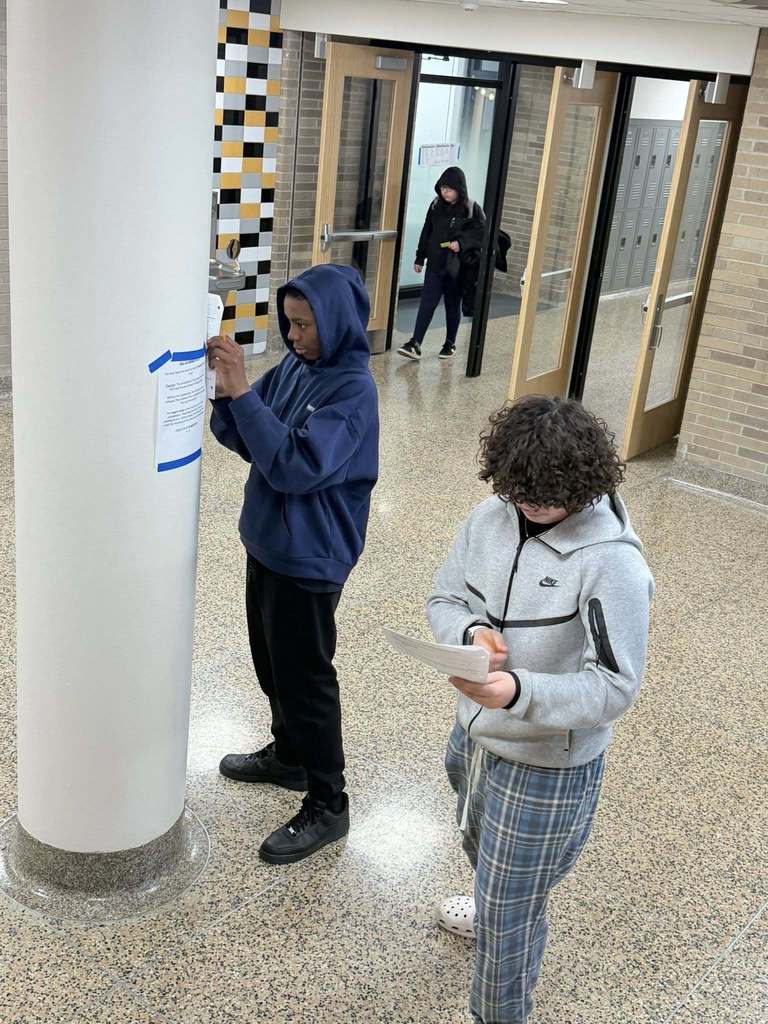 2 eighth grade students have found a clue and working on their assignment. 