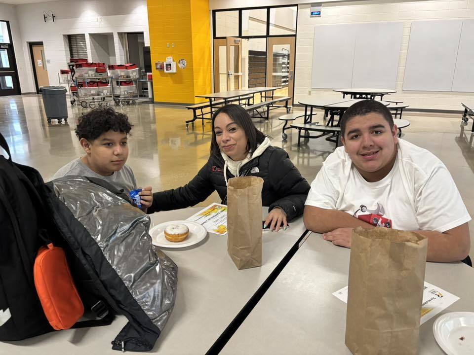 2 middle school students and their mom celebrate their perfect attendance.