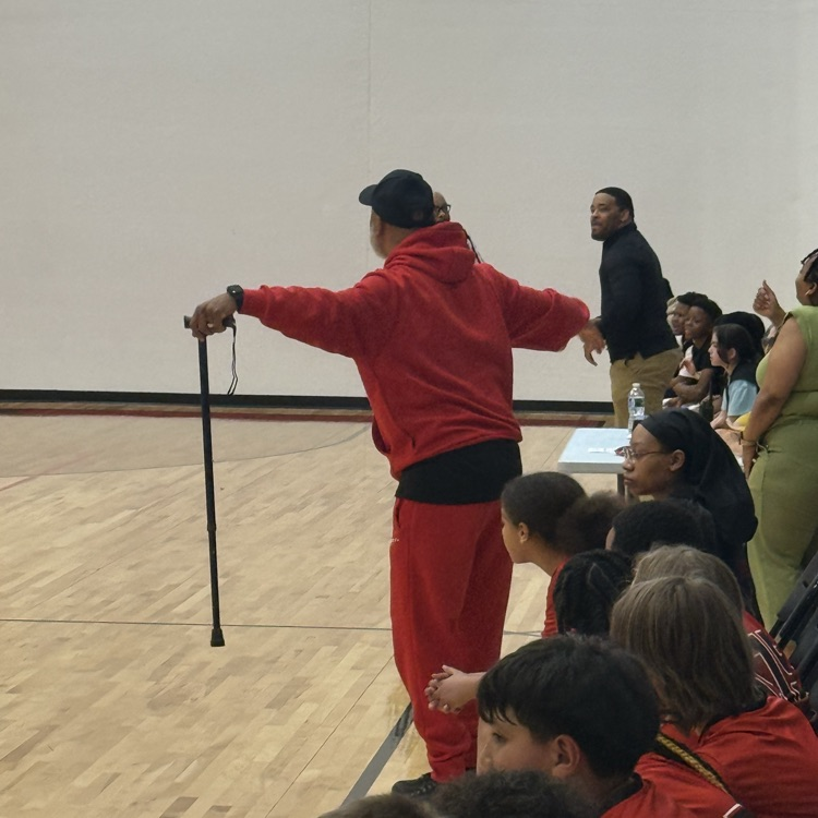 Coach telling his team to play defense  