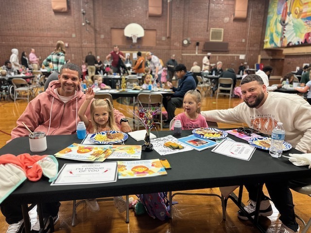 Two dad with their daughters.