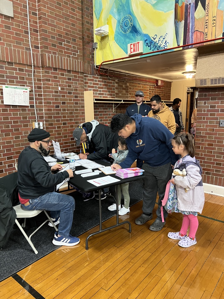 Families signing in for event.