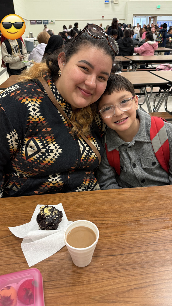 A mother and her child, enjoying breakfast.