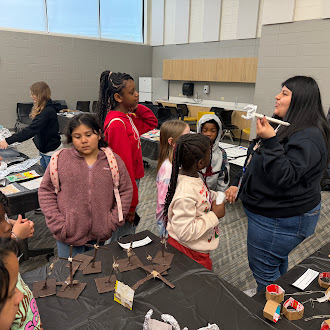 Elementary students walk through the Latin America history exhibit