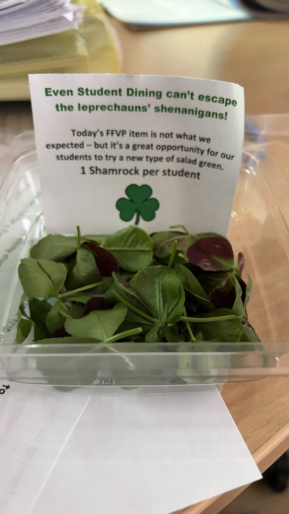 A pack of clovers, with a sign that says "