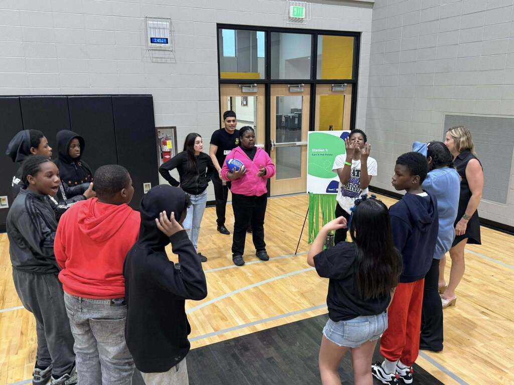 Students play a game as part of the Everfi celebration.