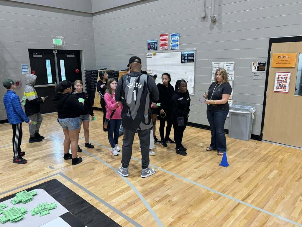 Students play a game as part of the Everfi celebration.