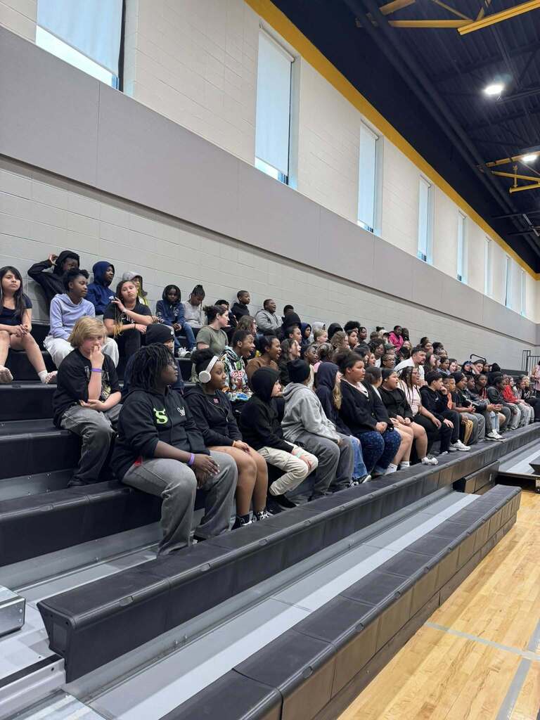 All of the sixth grade students listen to an address by Mr. Paproth at our Everfi celebration in the elementary gym.