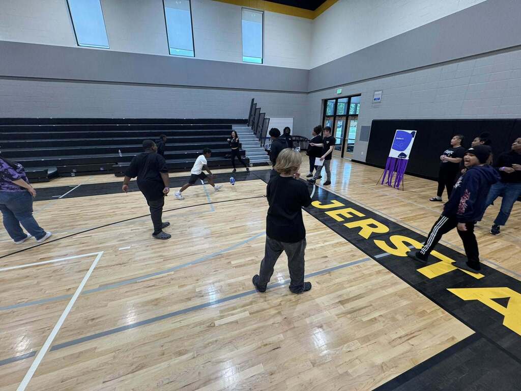 Students play a game as part of the Everfi celebration.