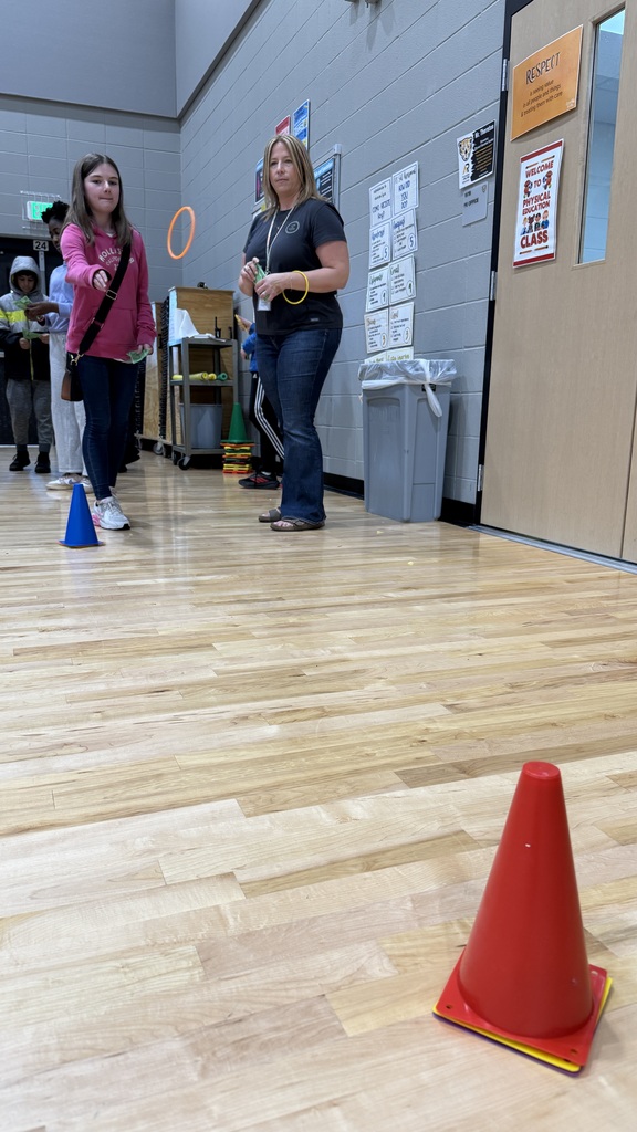 A female student playing a ring toss game