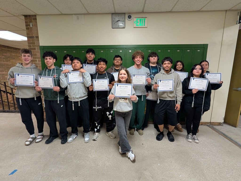 Fourteen students who were part of the 2026 VITA program pose for a photo with their certificates.