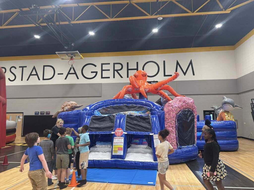 Under the Sea Bouncy House with students waiting in line.