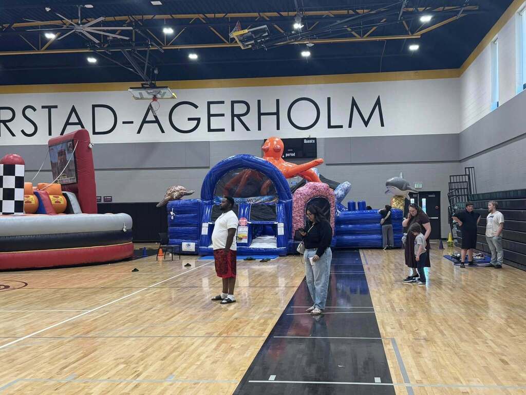 Students and their families play at the spring title night.