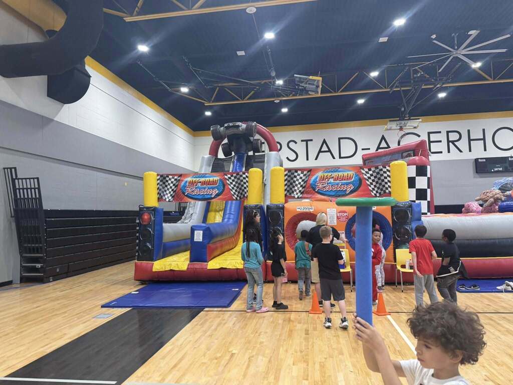 Blow up obstacle course with students waiting in line.