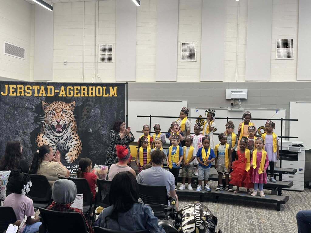 Ms. Latham and her 4K students at their promotion ceremony.