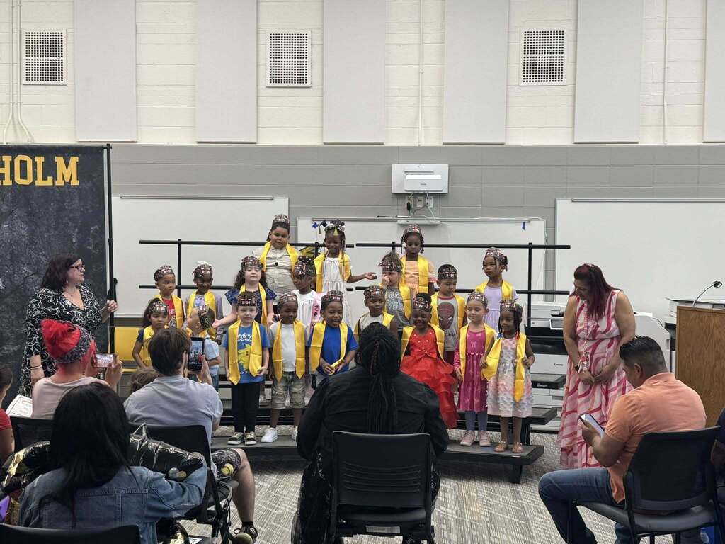 Ms. Latham and her 4K students at their promotion ceremony.