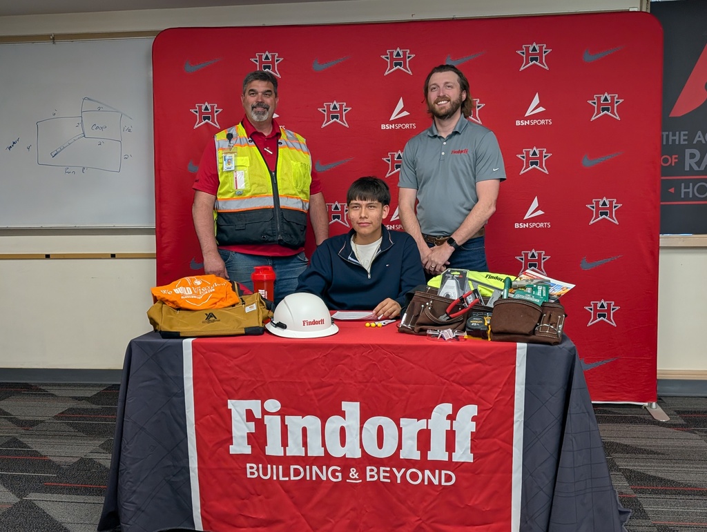 Juan and representatives from Findorff at his signing ceremony.