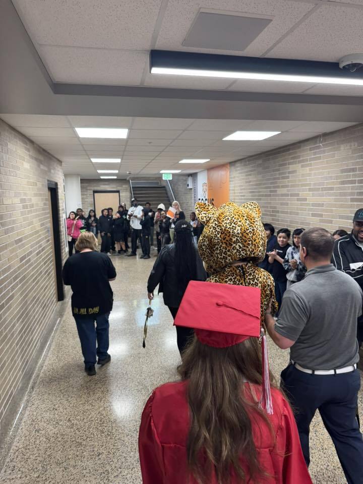 The kindergarten students, Jerry the Jaguar and seniors walk the halls of JA with the other students celebrating them.