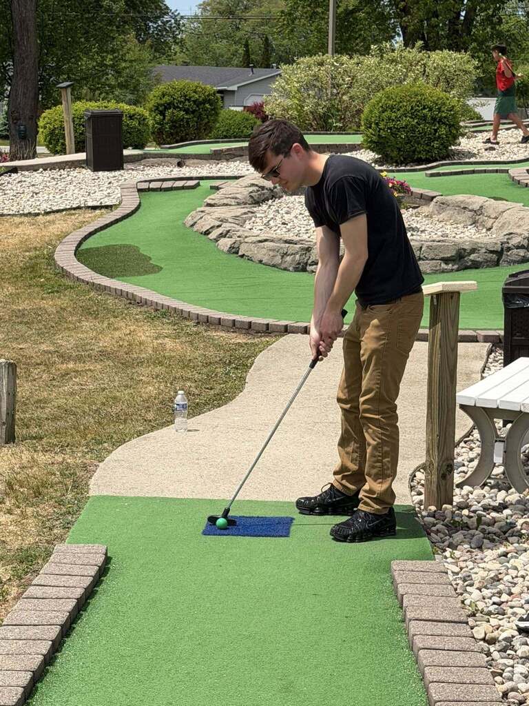Students play mini golf