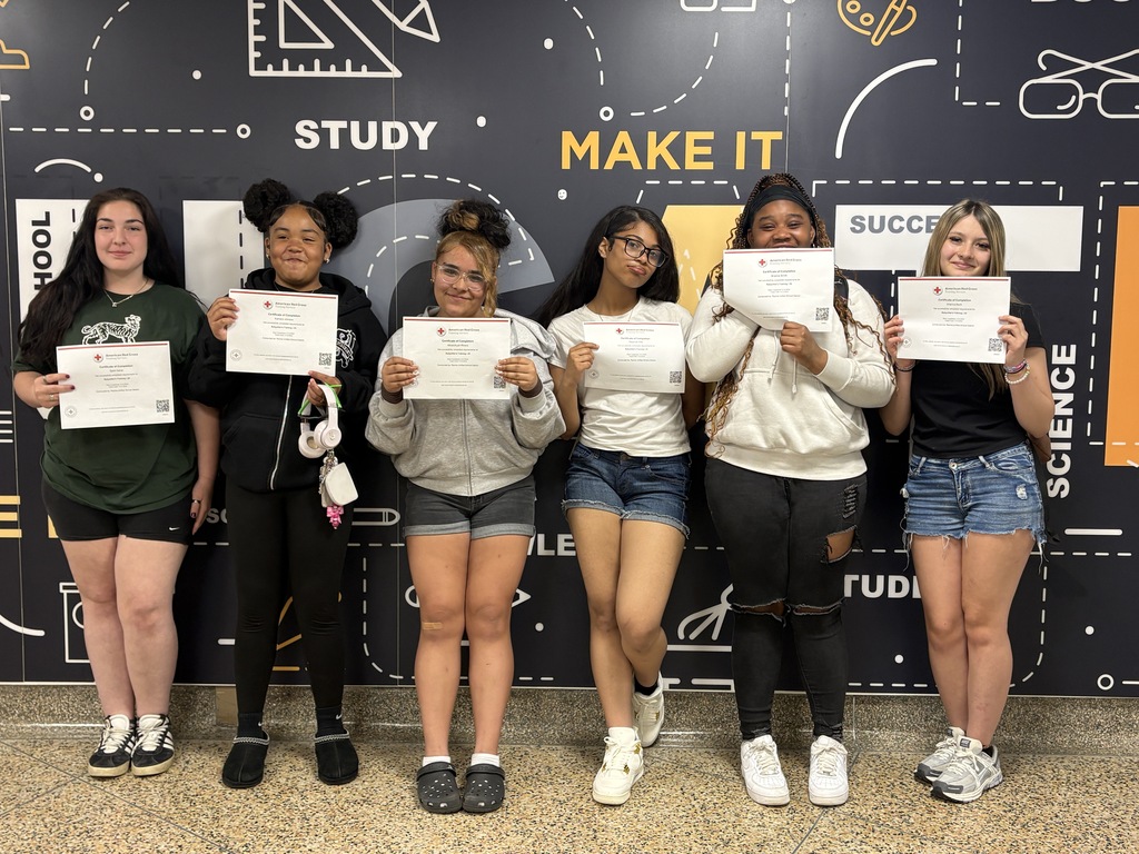 Students pose with their babysitting certification. 