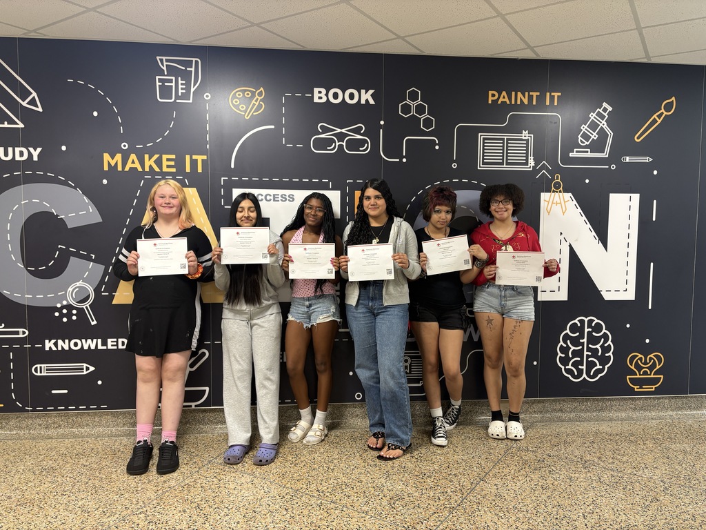 Students pose with their babysitting certification. 