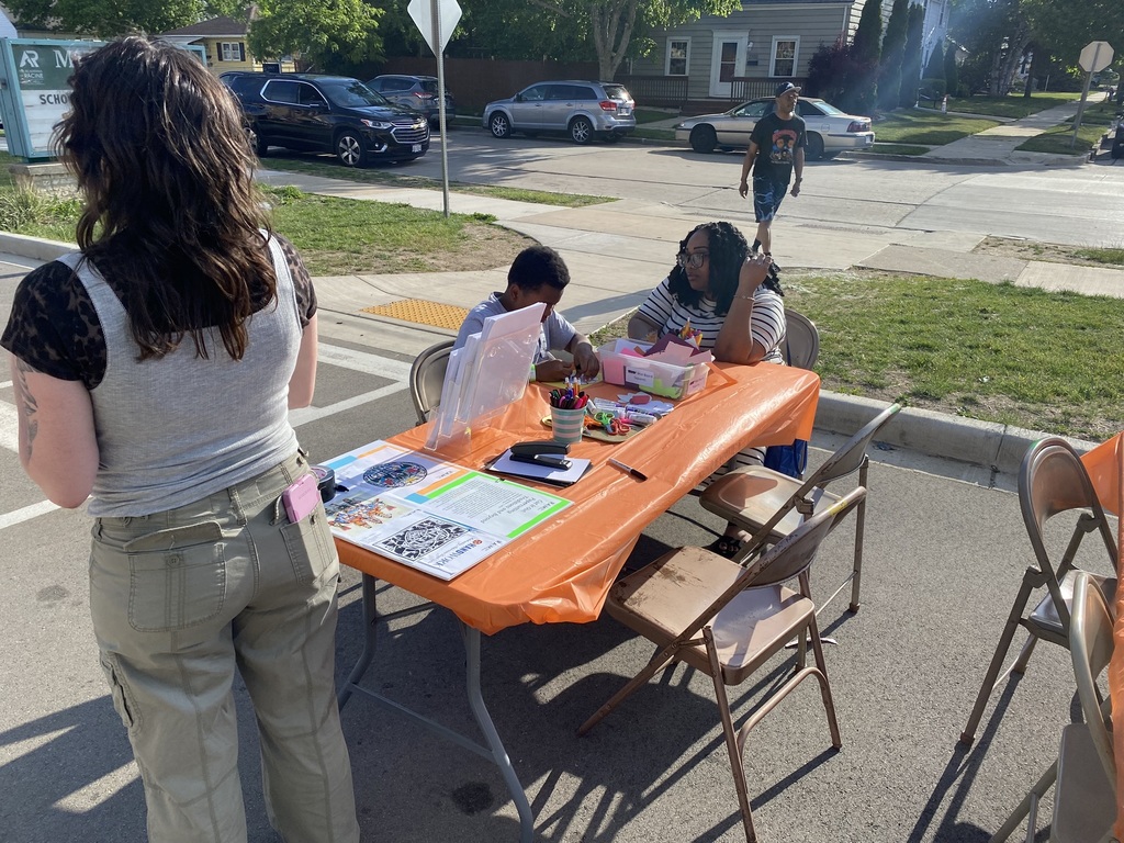 A boy and his mother do a craft by Racine Art Museum.