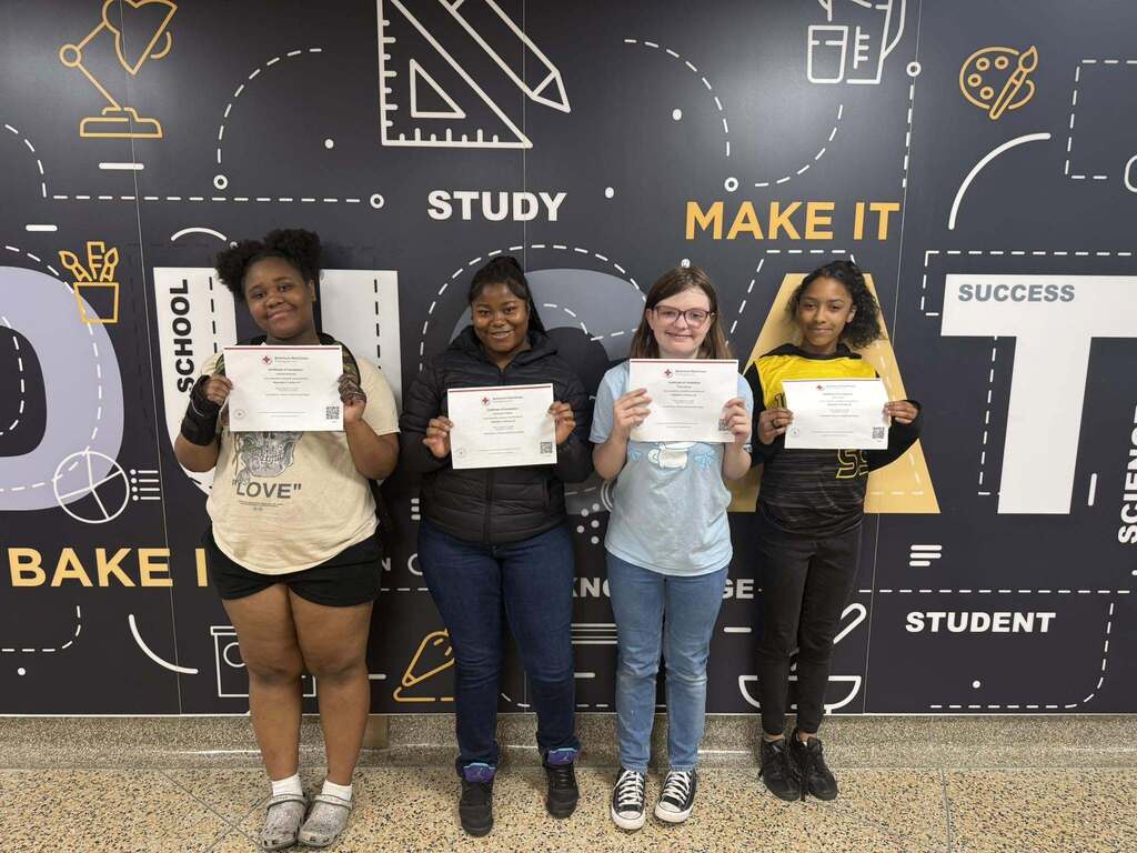 Students pose with their babysitting certification.