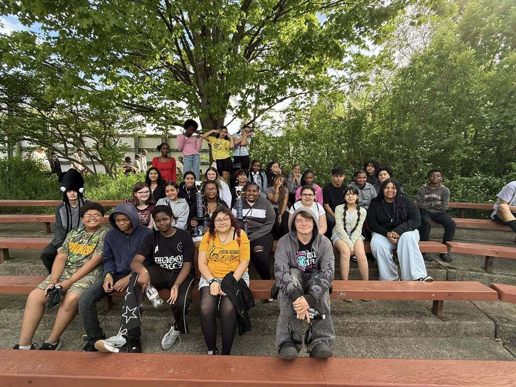Our middle school band and orchestra students posing with their trophies from music in the parks!