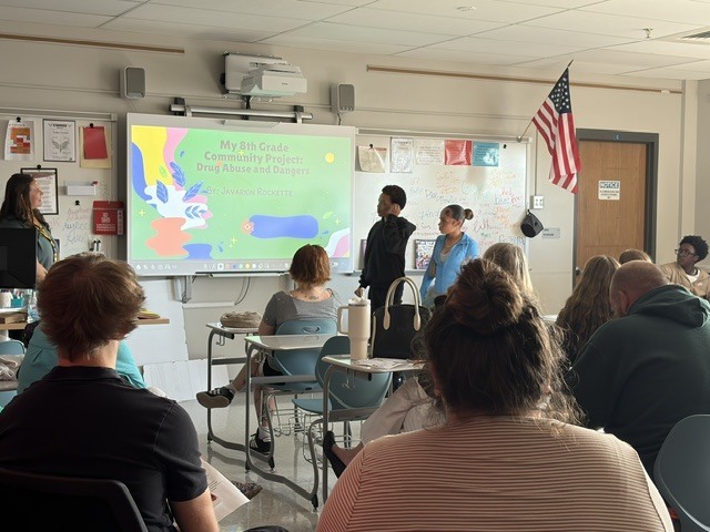 Two students give a classroom presentation on Drug Abuse and Dangers.