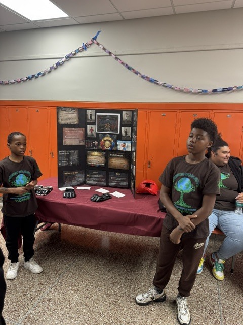 Two students standing in front of their project.